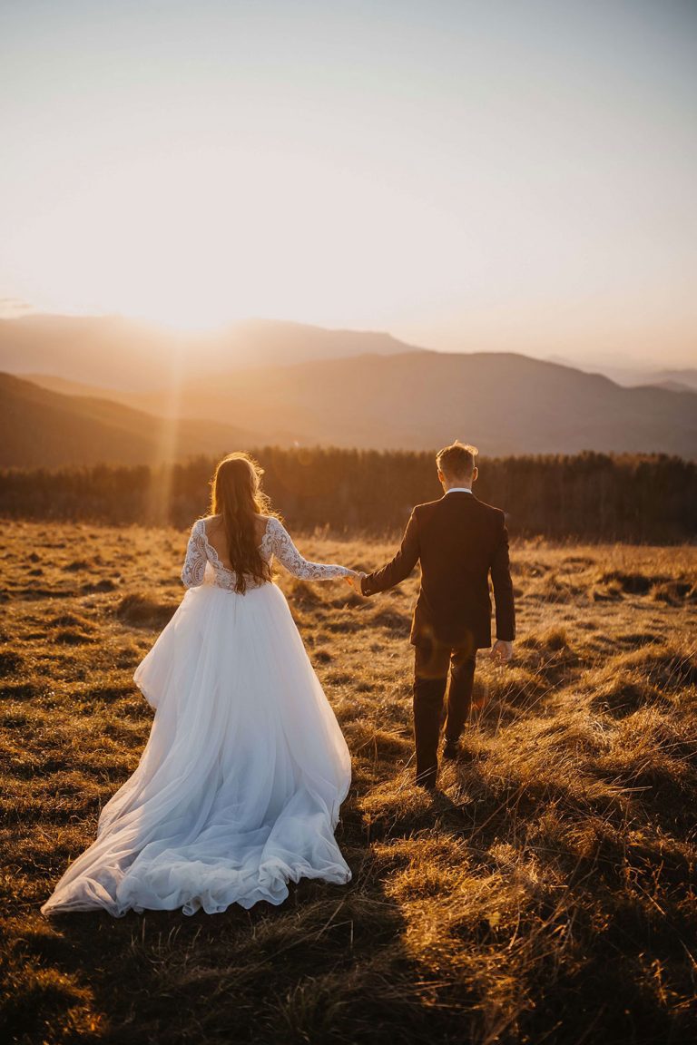 married couple watching sunset